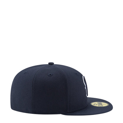 Navy baseball cap side view with embroidered logo and flat brim