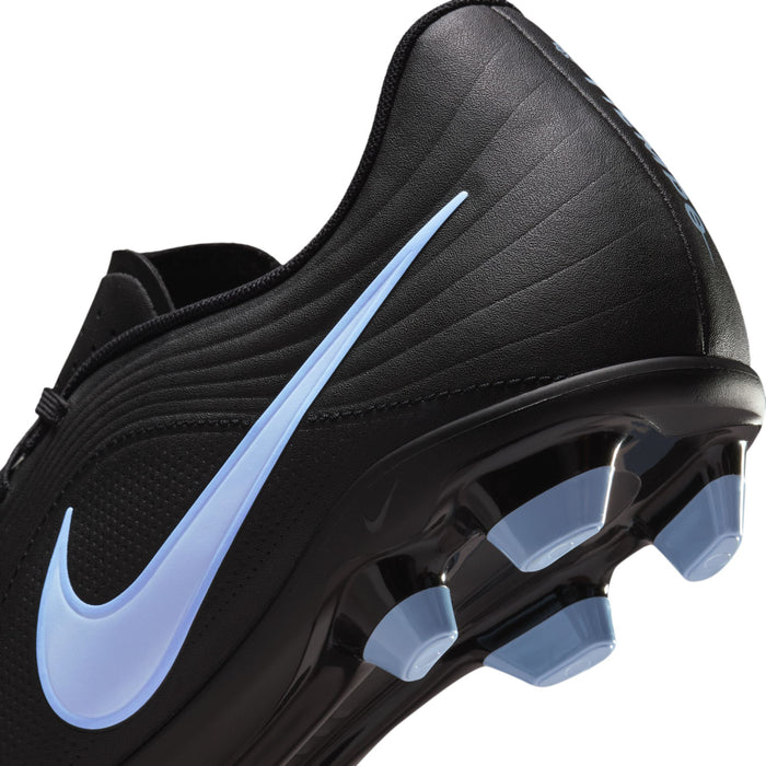 Black soccer cleat close-up with light blue Nike swoosh and studded outsole