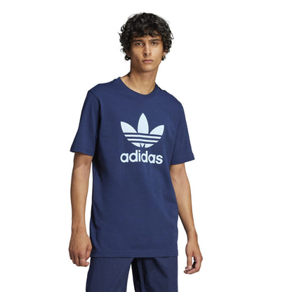 Men's navy trefoil graphic T-shirt worn by model, adidas logo on chest