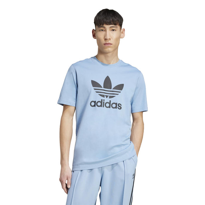 Men's light blue trefoil adidas t-shirt worn with matching track pants