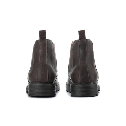 Men's dark brown chelsea boots showing heel and elastic back panels with cushioned sole