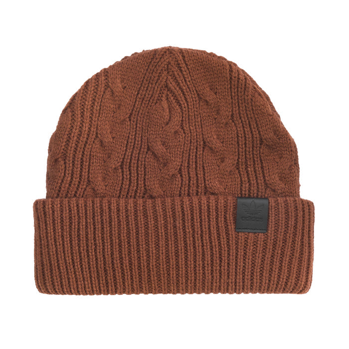 Brown cable-knit beanie with folded ribbed cuff and small leather-look logo patch