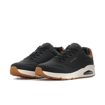 Men's black lace-up sneaker pair with tan outsole and white air-cushion panel
