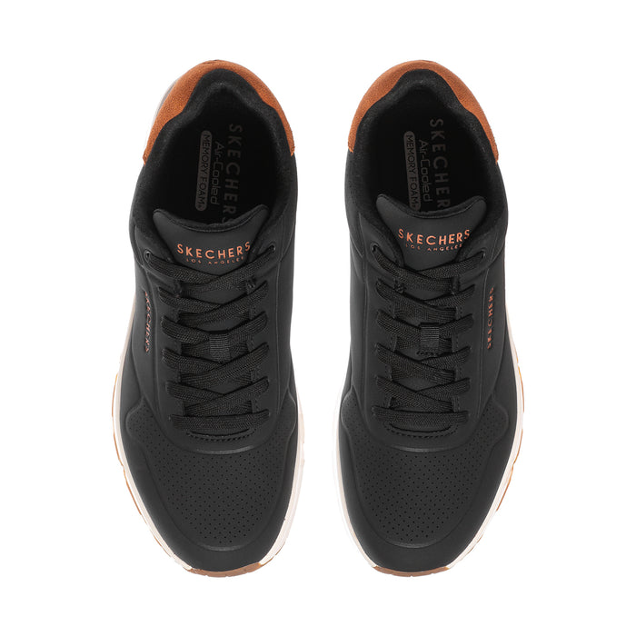 Men's black lace-up sneakers with perforated toe and tan-lined collar