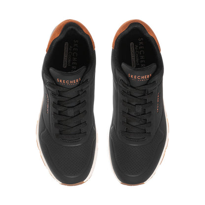 Men's black lace-up sneakers with perforated toe and tan-lined collar