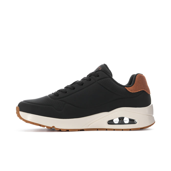 Men's black lace-up sneaker side view with tan upper accents and air sole
