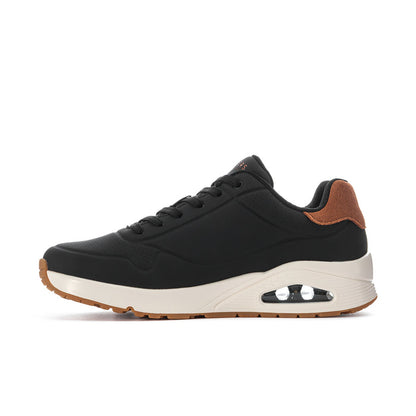 Men's black lace-up sneaker side view with tan upper accents and air sole