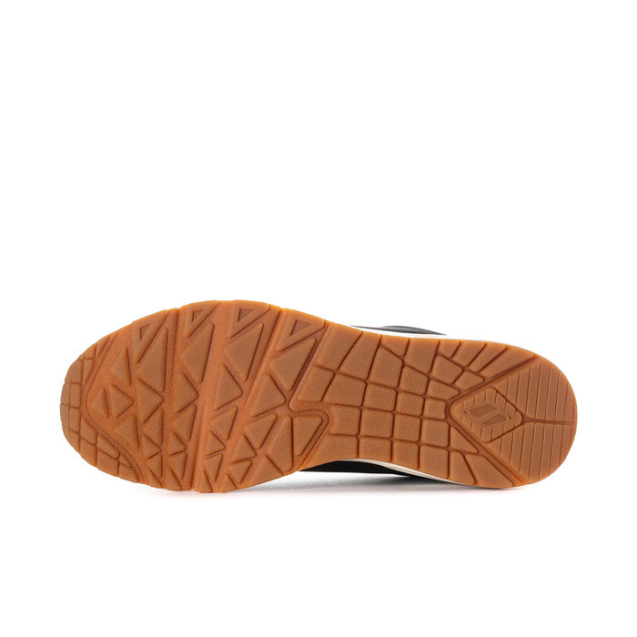 Men's black sneaker outsole with textured tan tread