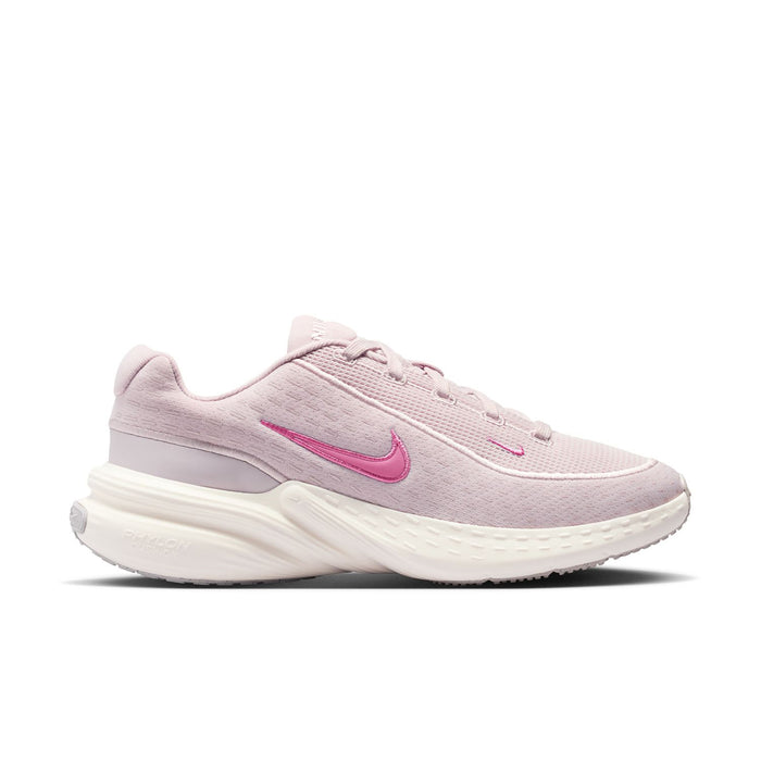 Women’s lace-up running sneakers in light mauve with pink Nike Swoosh and white sole