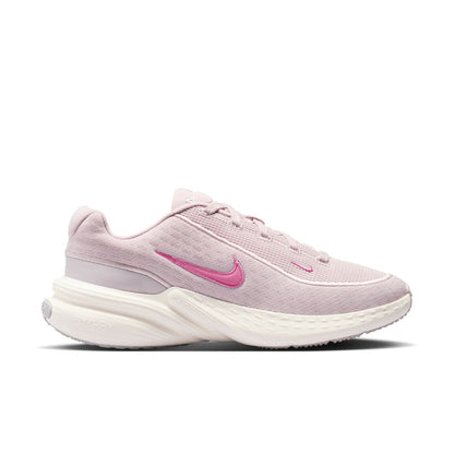 Women’s lace-up running sneakers in light mauve with pink Nike Swoosh and white sole