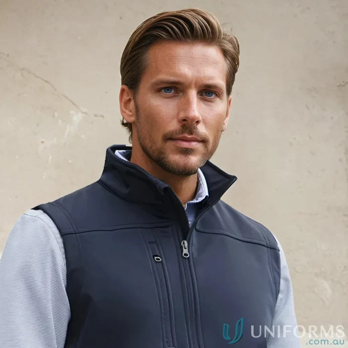 Man wearing navy U:Tech SoftShell Vest, perfect mens softshell vest to stay warm