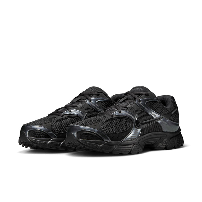 Men's black athletic sneaker with metallic quarter details, lace-up mesh, chunky sole