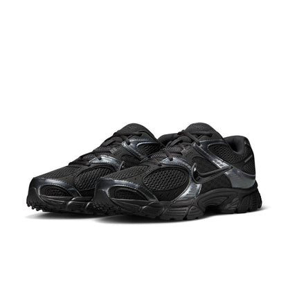 Men's black athletic sneaker with metallic quarter details, lace-up mesh, chunky sole