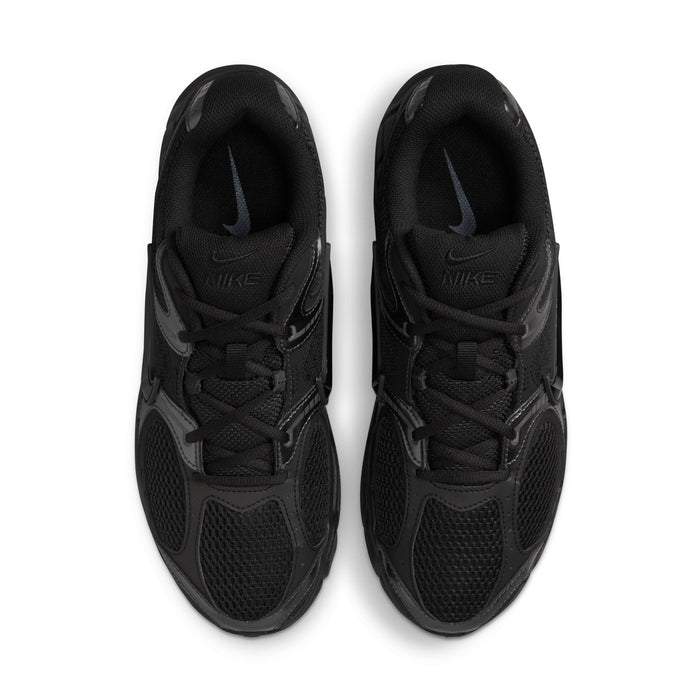 Men's black lace-up sneakers with cushioned tongue and Nike logo on the toe