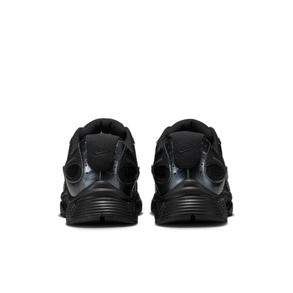 Men's black sneakers with rear pull tab and ribbed heel cushioning
