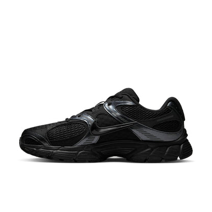 Men's black sneaker with silver Swoosh stripe, perforated toe panels, lace-up