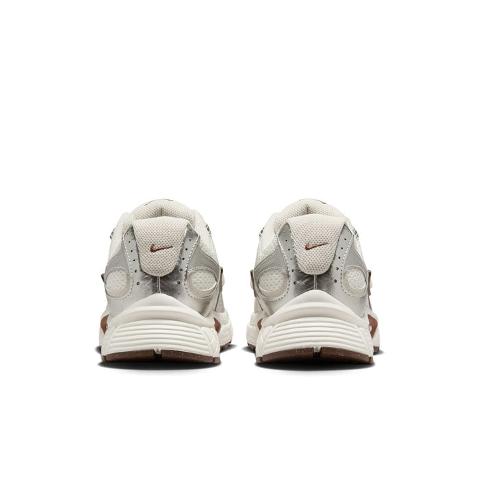 White Nike sneakers, rear view with heel tab and cushioned sole details.