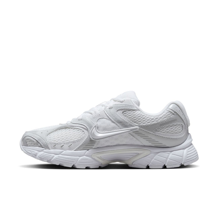 White lace-up running shoe with mesh upper, Swoosh logo, and textured midsole