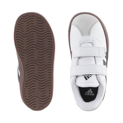 White toddler sneaker with brown outsole view and stitched strap detail, Adidas logo