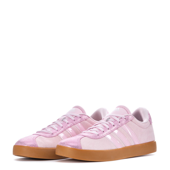 Pair of youth low-top sneakers in light pink with lace-up ties and gum outsole