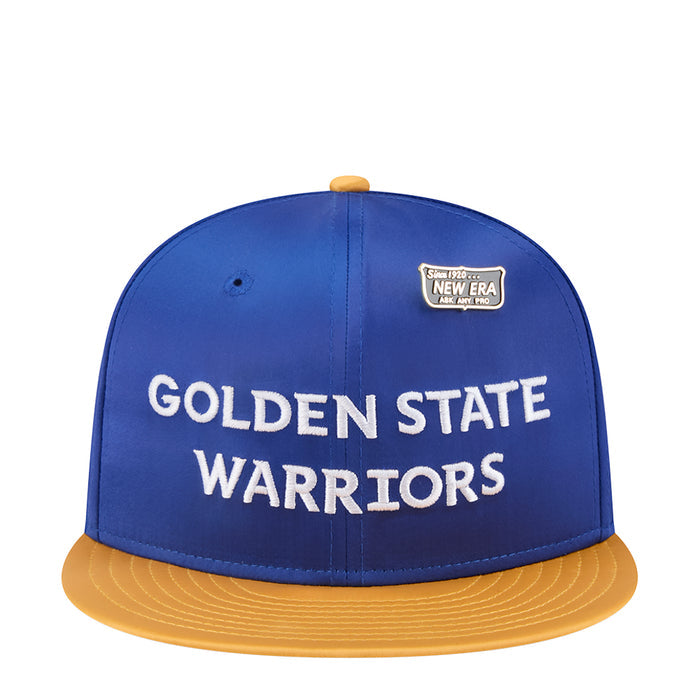 Blue satin baseball cap with yellow brim, white Golden State Warriors text