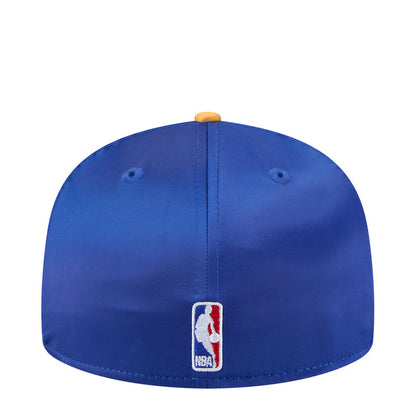 Blue satin baseball cap with yellow brim, MLB-style logo patch on back