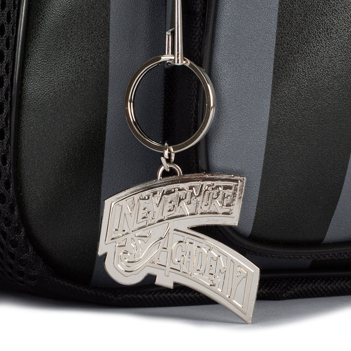 Black backpack zipper pull with silver keyring and academy logo charm