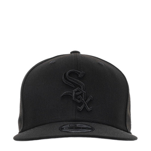 Black baseball cap with embroidered emblem and curved brim