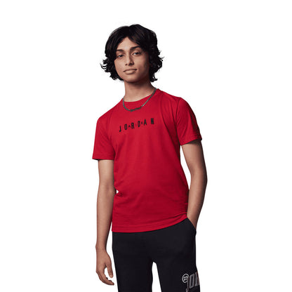 Gym Red youth crewneck T-shirt with embroidered "JORDAN" wordmark, worn by model