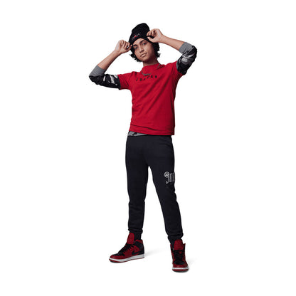 Gym Red youth crewneck T-shirt with embroidered "JORDAN" wordmark, full-body view
