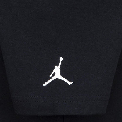 Youth black T-shirt sleeve hem with embroidered Jordan Jumpman logo