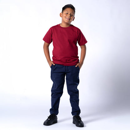 Youth navy woven jogger pants with elastic waistband, drawstring and tapered legs