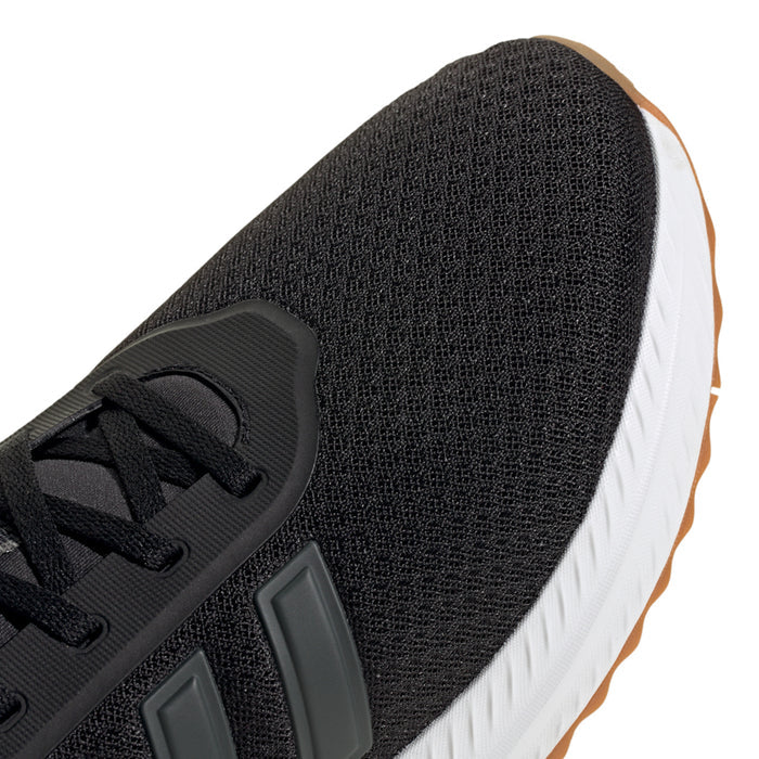 Men's wide running shoes, black knit side close-up with gray stripe panel and laces