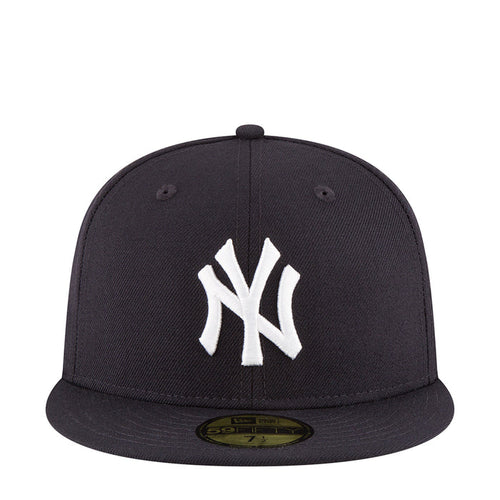Dark baseball cap with white NY logo on front panel