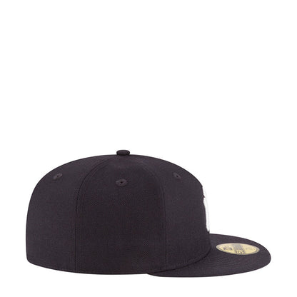 Dark baseball cap, side view with curved brim and top button