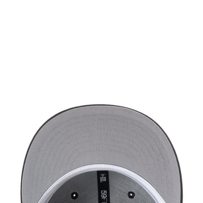 Baseball cap interior top view with small black brand tag