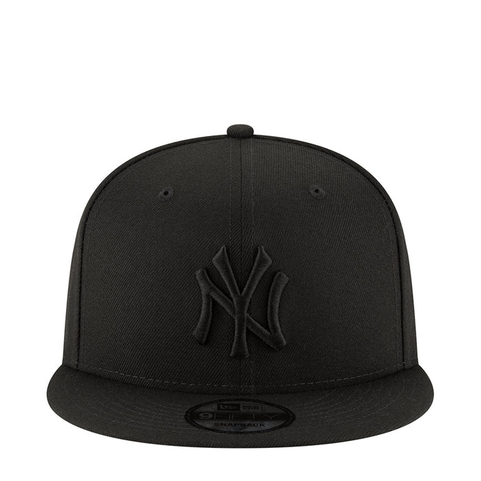 Black baseball cap with raised NY logo on the front and curved brim