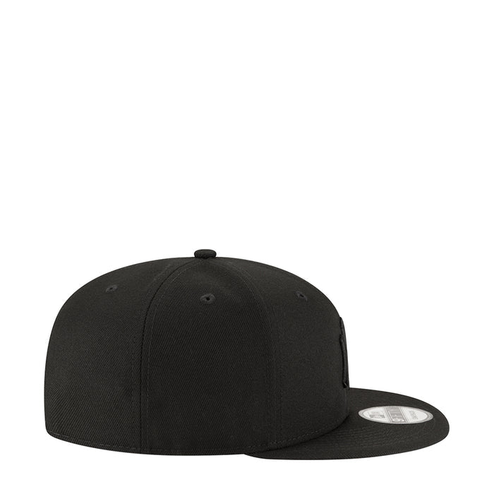 Black snapback baseball cap with curved brim and low-profile crown