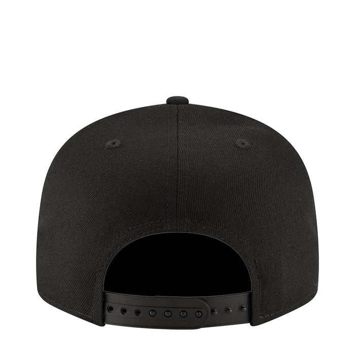 Black baseball cap back view with adjustable strap and six-hole detail
