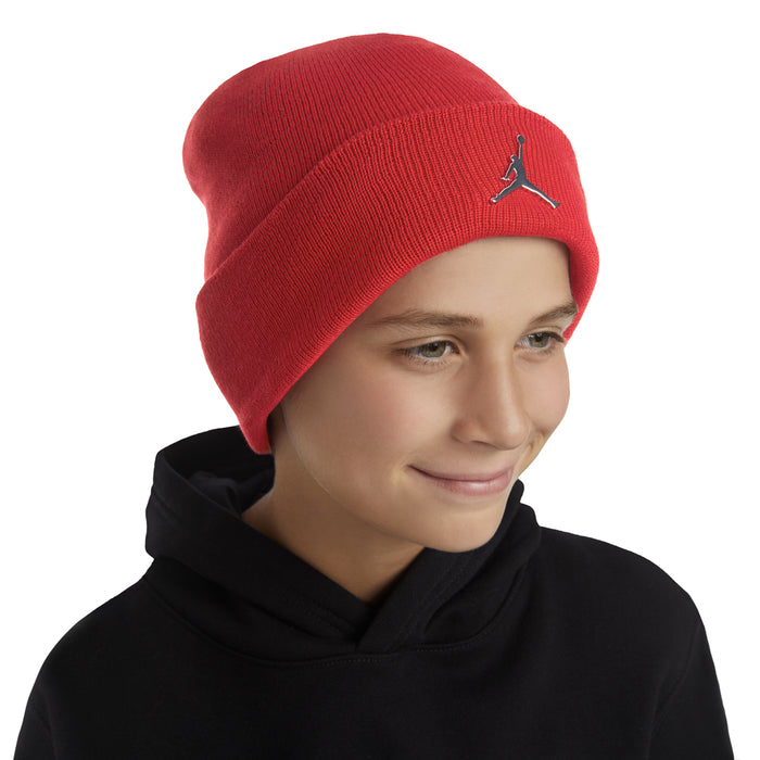 Youth red cuff beanie on model with Jumpman logo