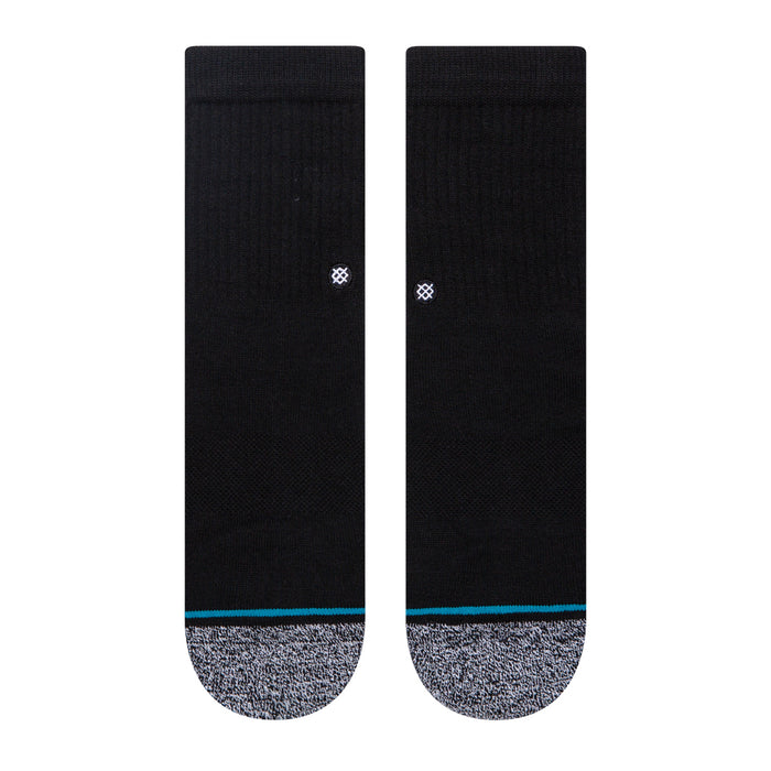 Pair of black crew socks, gray footbed, blue stripe, small white logo on back.