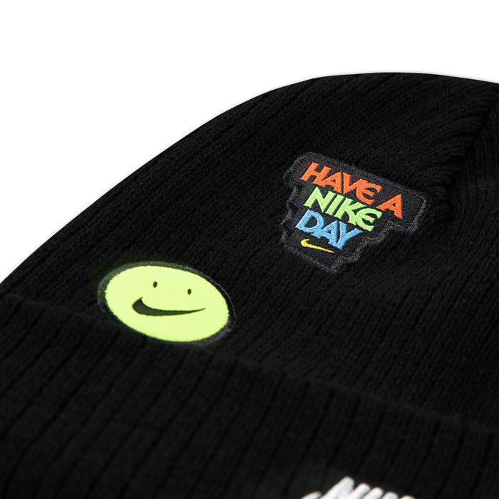 Black knit youth beanie with "Have a Nice Day" patch and smile face emblem