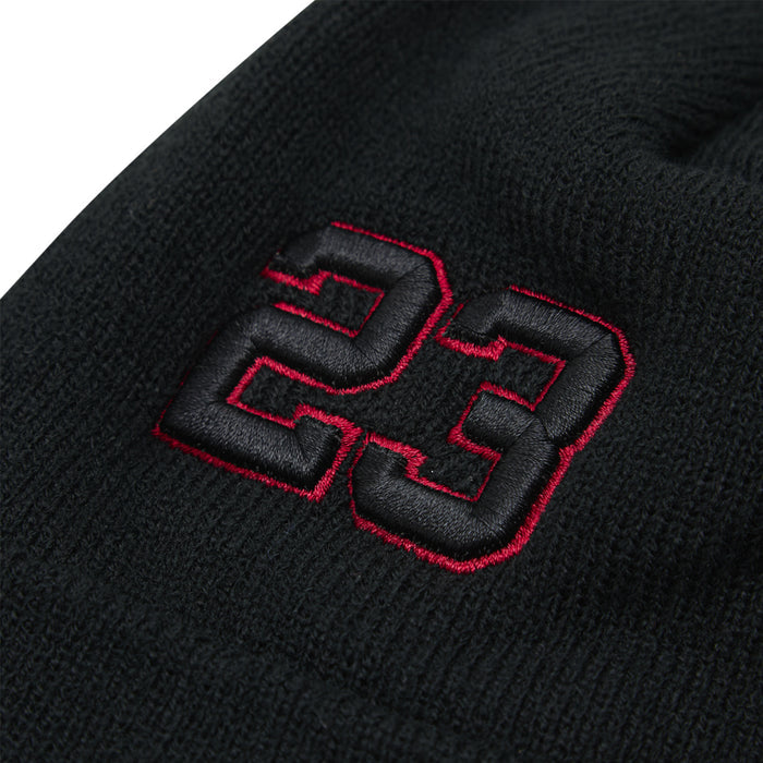 Black beanie close-up with red 23 embroidered patch