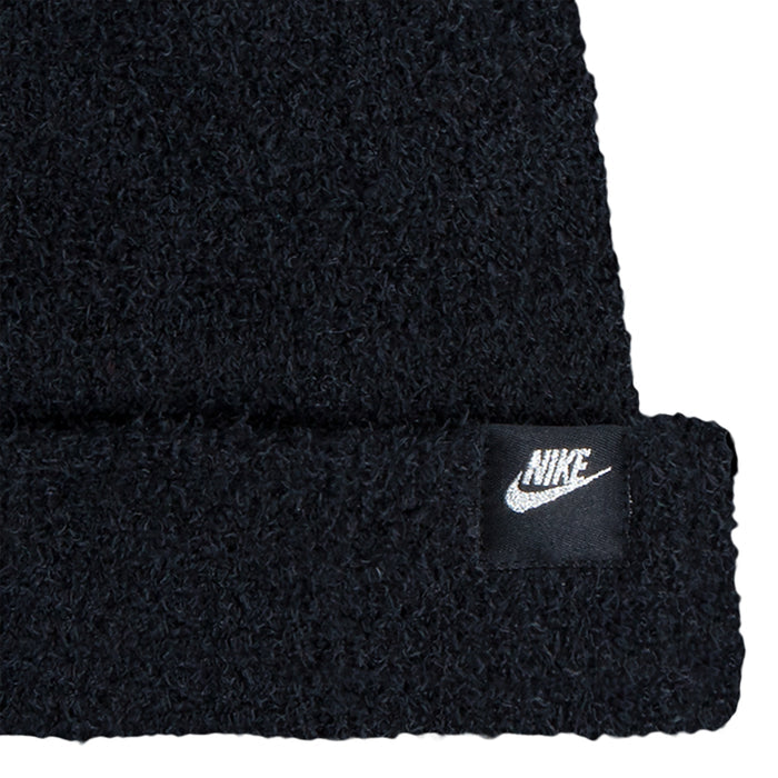 Black plush beanie cuff with Nike logo patch, textured knit